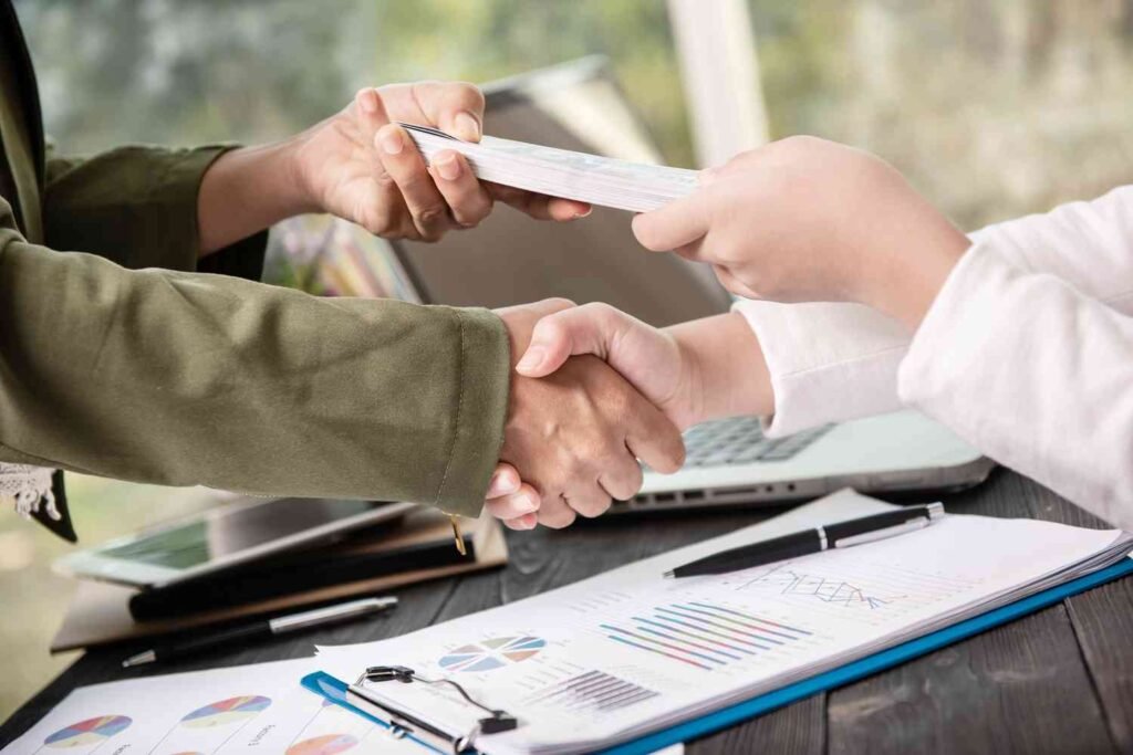 two men shaking hands after sucessful crowdfund loans